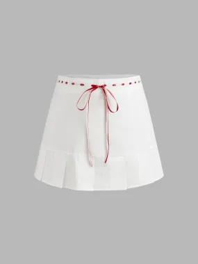 Falda Mini Plisada con Nudo y Ribete en Contraste de Tiro Medio